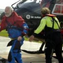 "Jinxed" sailor Yves Parlier, happy after being rescued from his upturned trimaran.