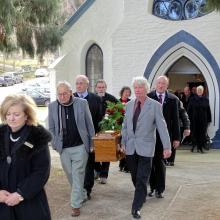 Family and friends carry the coffin of Arrowtown identity Jack Reid after his funeral in the...