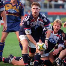 Blues flanker Mark Carter looks to move the ball on in a match at Eden Park in 1998 against the...