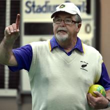 Ken Walker checks on the situation at the head during his match against fellow Dunedin bowler...