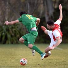 Green Island’s Cody Robinson (left) and Caversham’s Tore Waechter compete for the ball during...