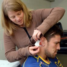 University of Otago  research fellow Dr Danielle Salmon pictured earlier this year applying  an...