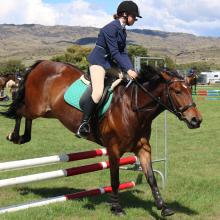 Catherine Guilfoyle (14), of Queenstown, participates in the showjumping competition at the...