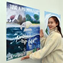 The Great Kiwi Poster Competition 2023 intermediate winner Danielle Wu  shows her poster at...