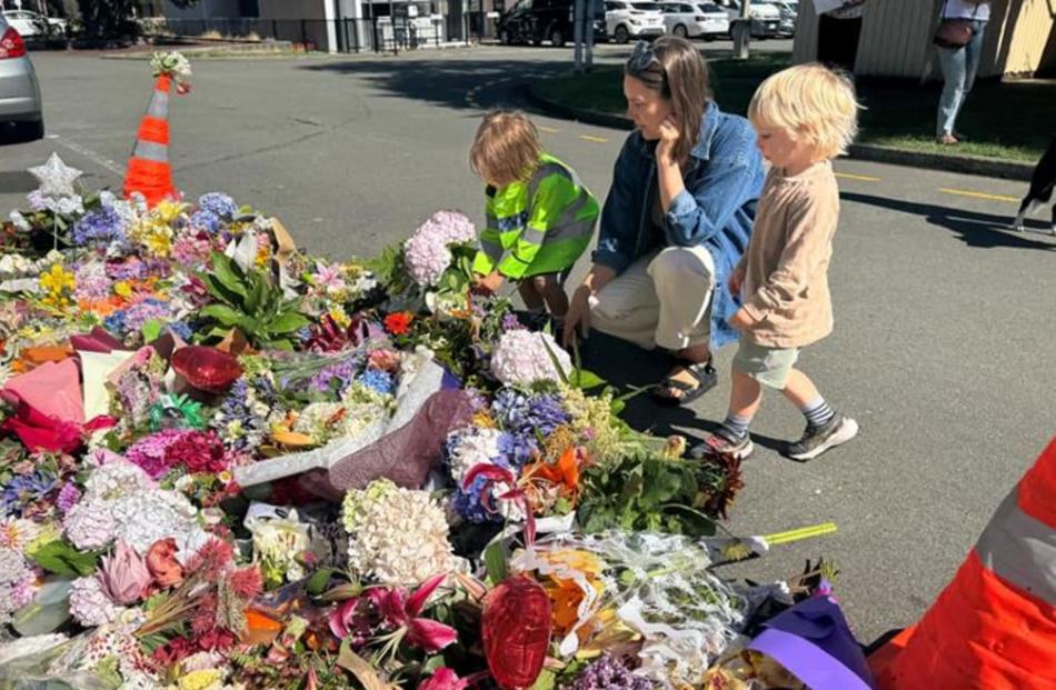 Amelia Boland and her two children Freddie and Chester deliver flowers. Photo: Pretoria Gordon / RNZ