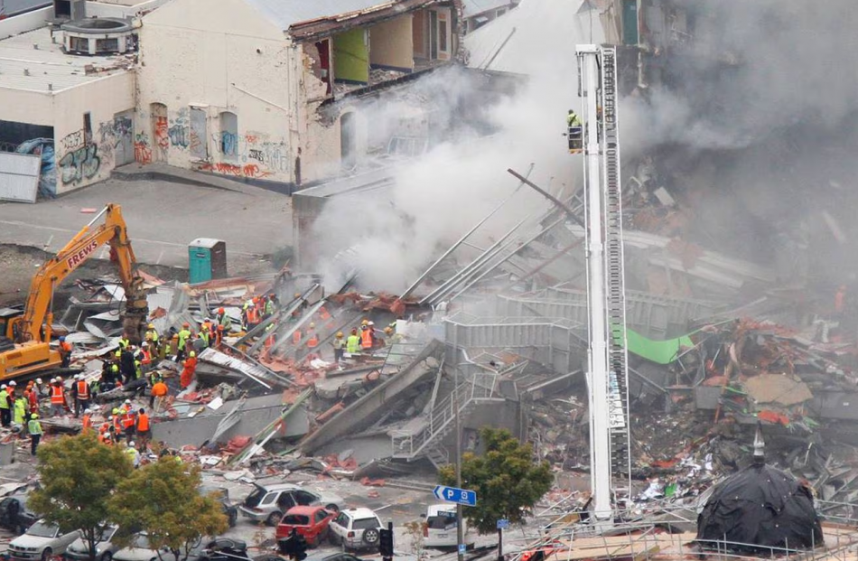 Firefighters, police and search and rescue crews working on the collapsed CTV building in central...
