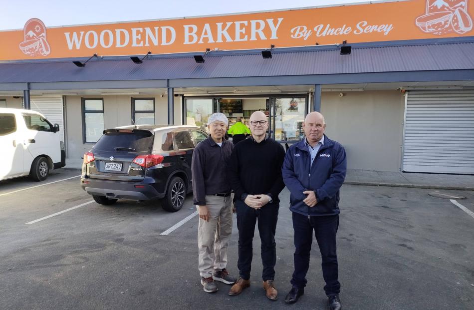 Woodend Bakery owner Serey Chum (left) chats to Waimakariri MP Matt Doocey and Woodend-Sefton...