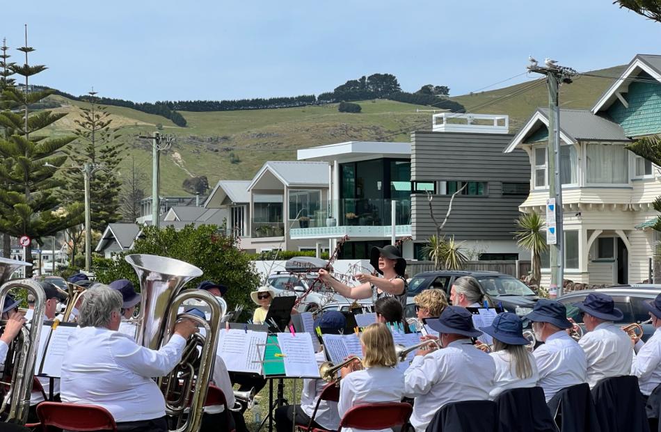 The Sumner Silver Band, led by conductor Vickie van Uden, performing at the Old Band Rotunda on...