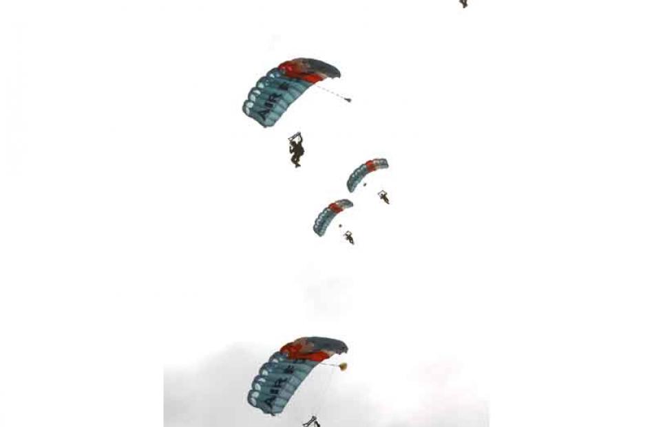 The RNZAF Kiwi Blue parachute drop out of the sun.