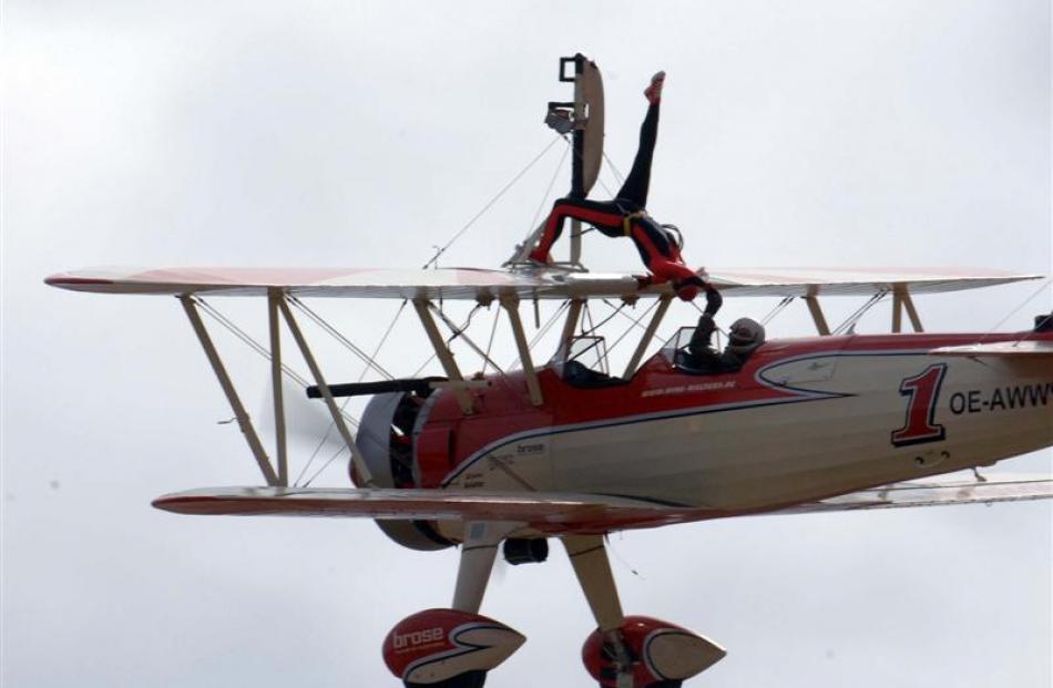 Ms Krainz goes through her paces at the Warbirds Over Wanaka airshow yesterday while Mr Walentin...