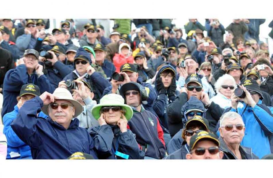 Part of the large crowd covering their ears. Photo by Peter McIntosh.