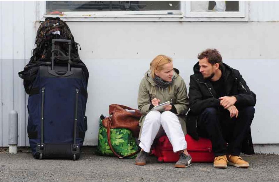 Anna Baumiller and Tomasz Kulesza from Poland wait patiently during a bomb scare at Dunedin...