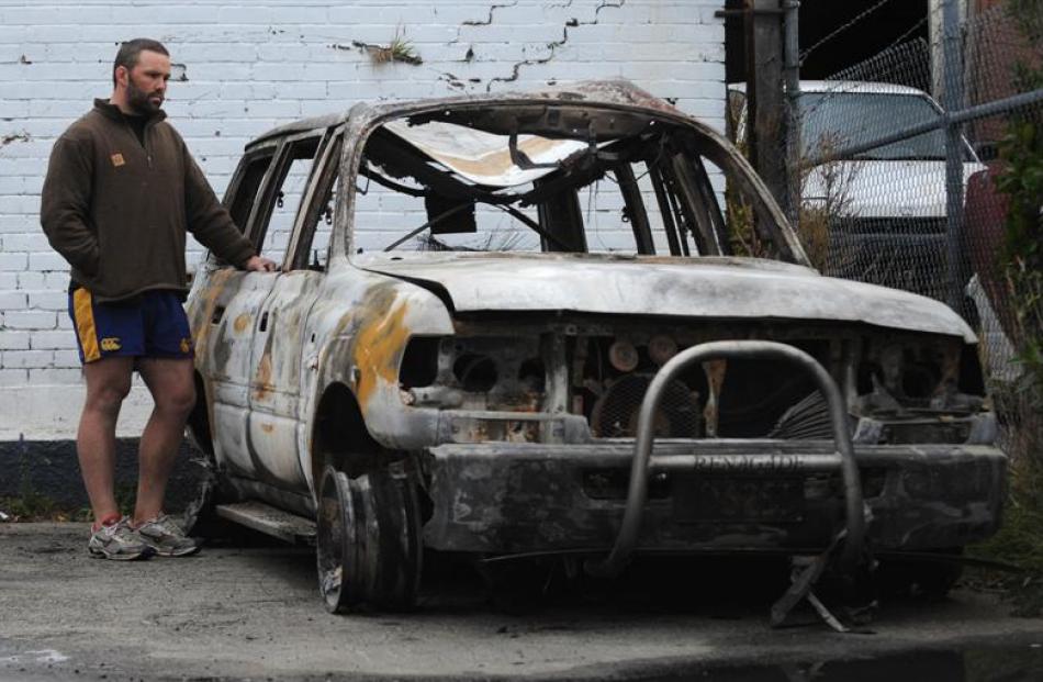 Jared Vercoe, of Highcliff Rd, Dunedin, with his four-wheel-drive vehicle which was damaged in an...