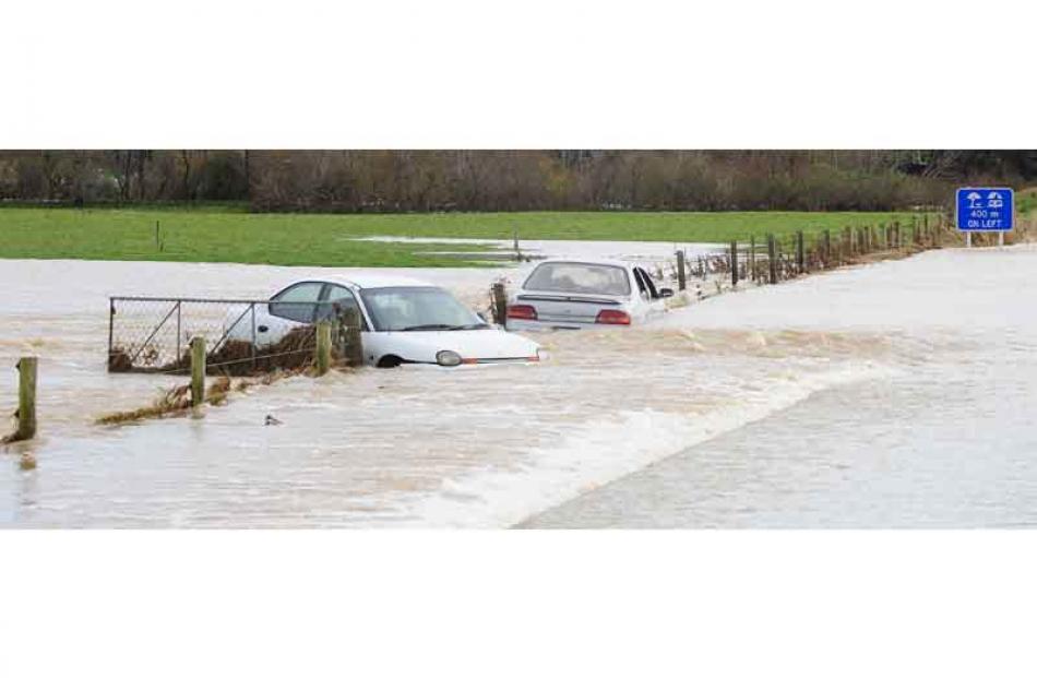 Two people were rescued overnight after trying, and failing, to drive their cars through this...