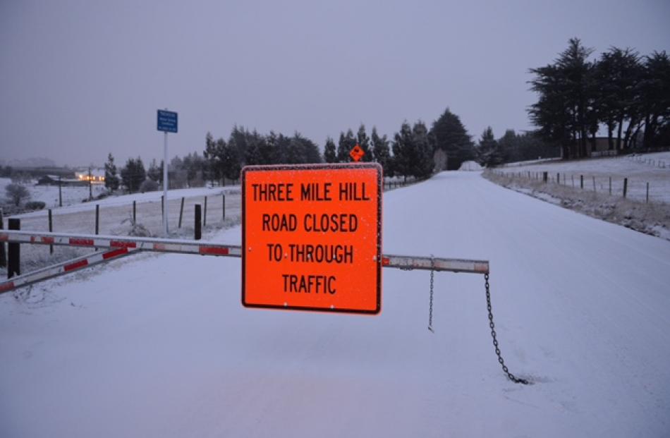 Three Mile Hill road is closed today. Photo Stephen Jaquiery