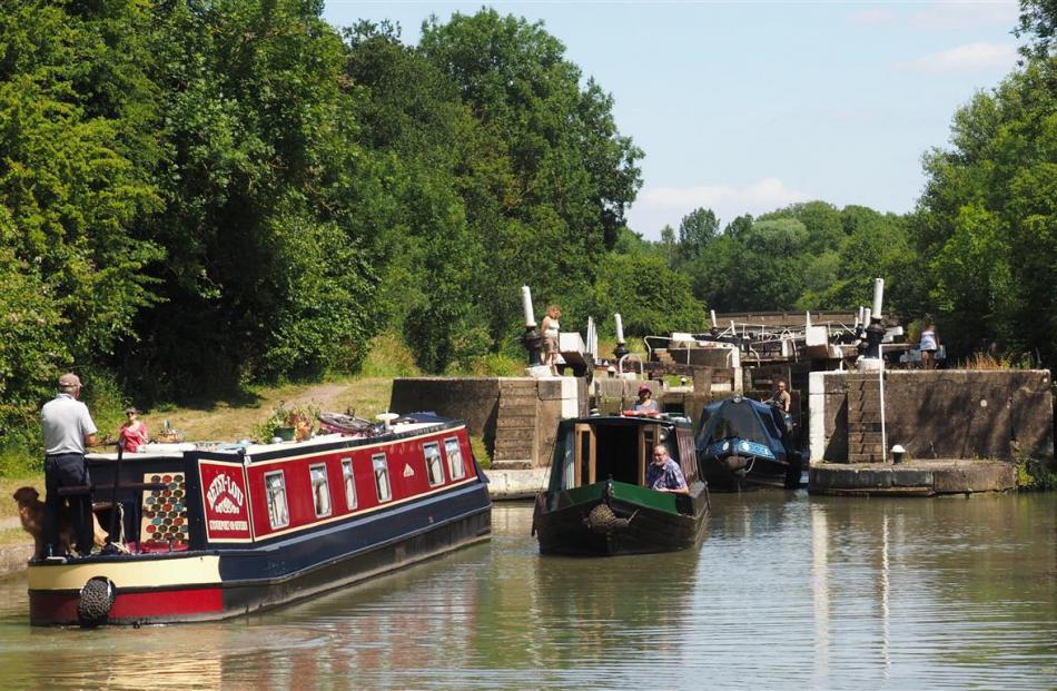 Most canal-boaters enjoy the chance to chat and compare notes while negotiating locks. 