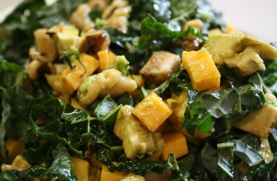 Add turkey or chicken, walnuts and avocado for a kale salad with lots of protein. Credit:...