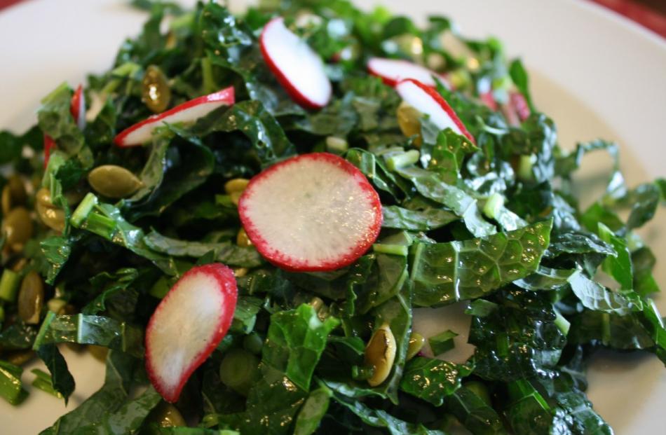 Slice radishes thin and toss them with kale and sliced green onions. Photo: Copyright 2016 Emily Grosvenor