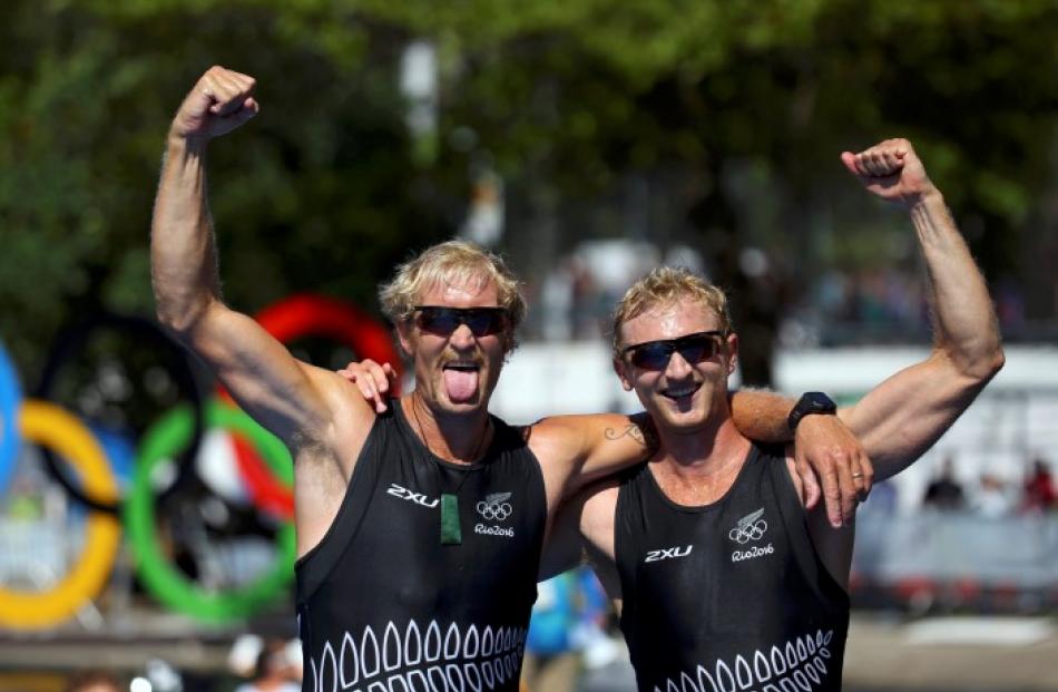 The pair savour their second consecutive Olympic victory. Photo Reuters