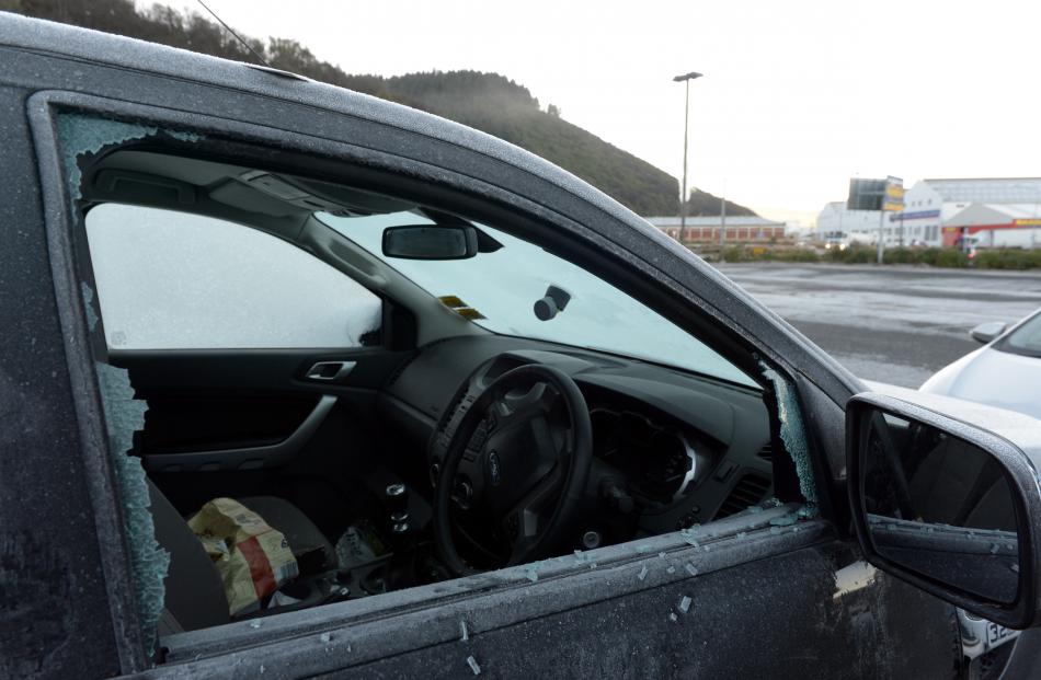 The shattered windows of vehicles in the car park behind Forsyth Barr Stadium. Photos by Gerard O'Brien.