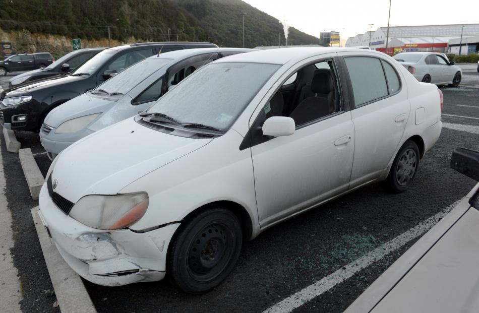 The shattered windows of vehicles in the car park behind Forsyth Barr Stadium. 