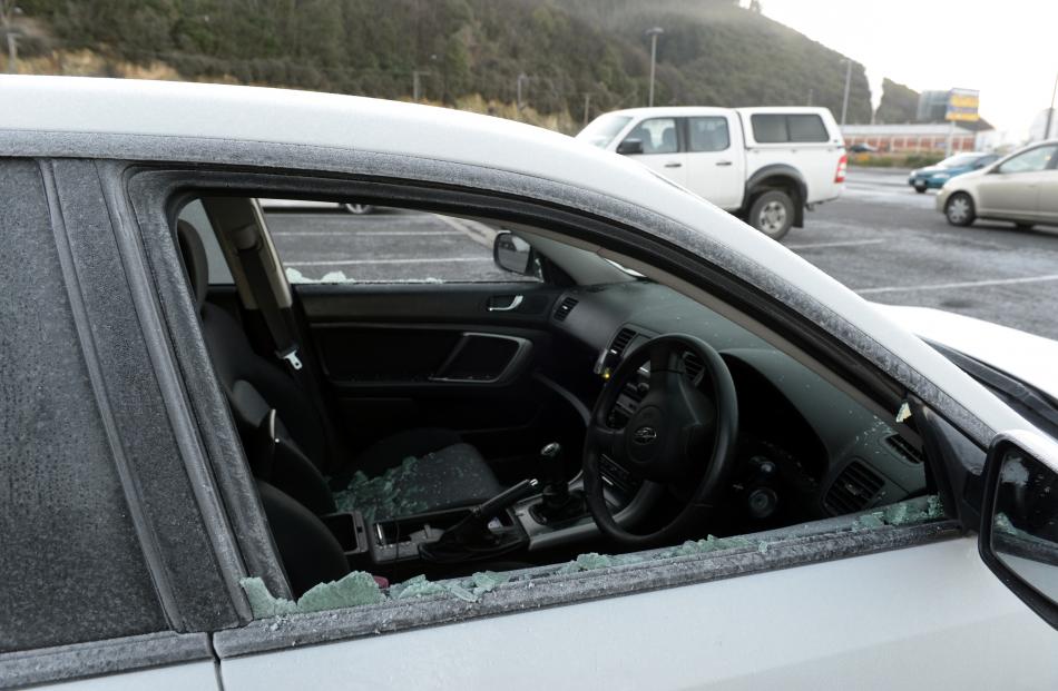 The shattered windows of vehicles in the car park behind Forsyth Barr Stadium. 