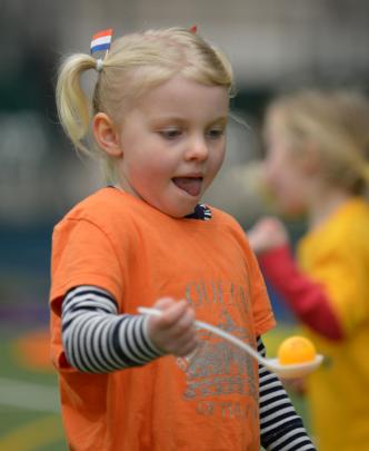 Lani Huntley (4) tries a different method while competing in the egg and spoon race. 
