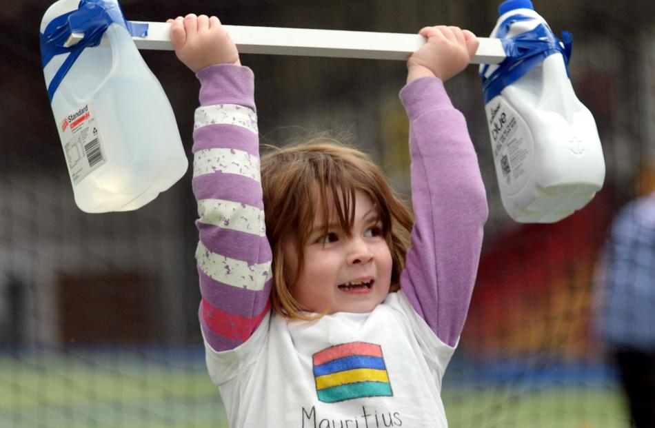 Jessica Verhoef (4) puts her muscles to the test at the Pioneers early childhood organisation...