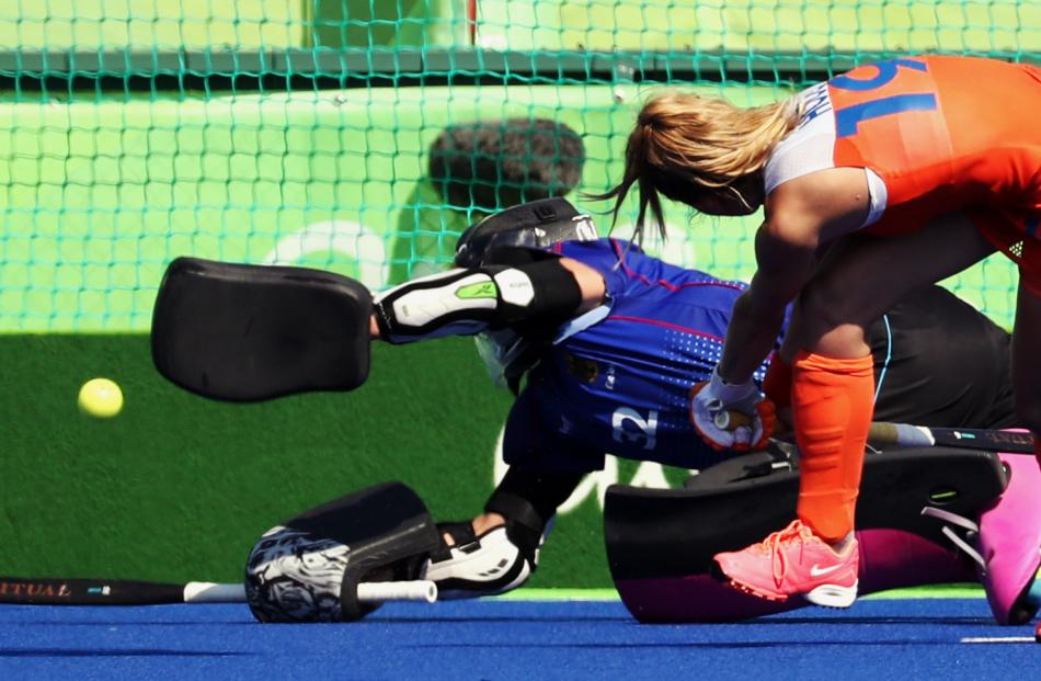 Ellen Hoog of Netherlands scores the winning goal during the penalty shootout.  Photo: Reuters 