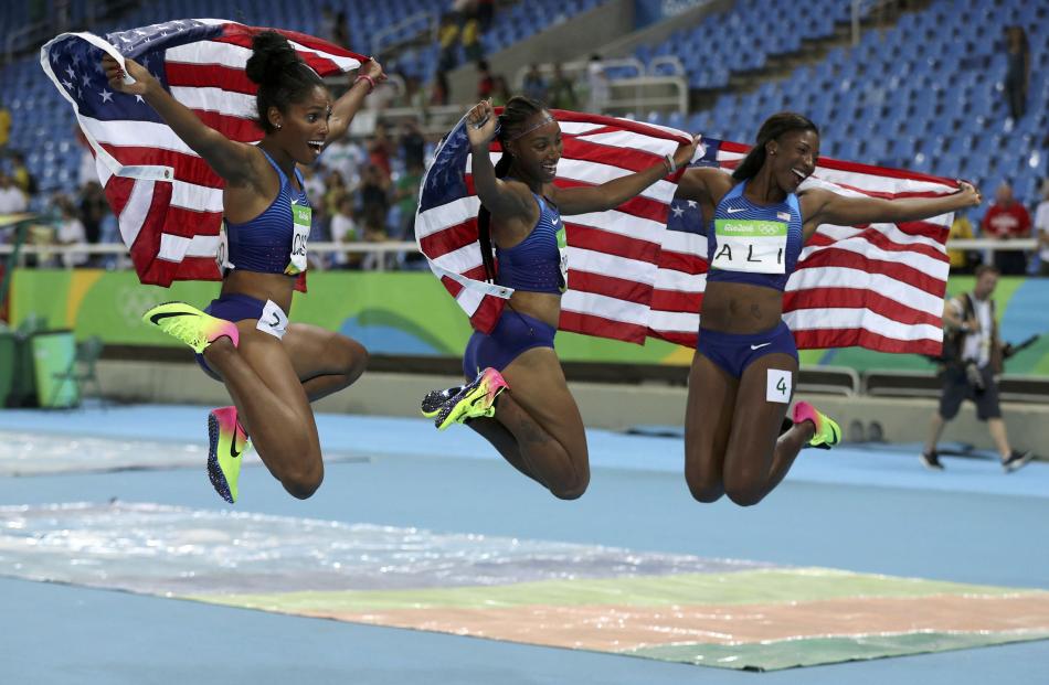 From left: Brianna Rollins, Nia Ali and Kristi Castlin celebrate after the hurdles final. Photo: Reuters 