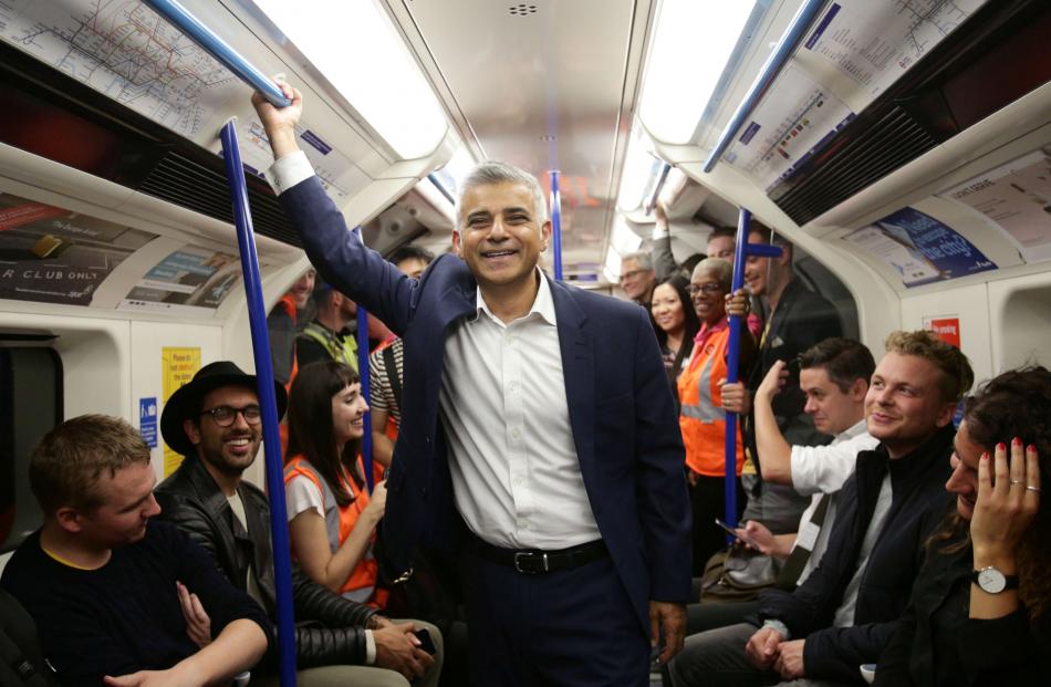 London mayor Sadiq Khan takes a trip on the Victoria line. Photo: Reuters 