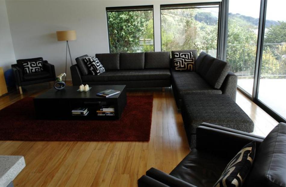 AFTER: A large expanse of glass in the living area allows views up the harbour and back to Dunedin.