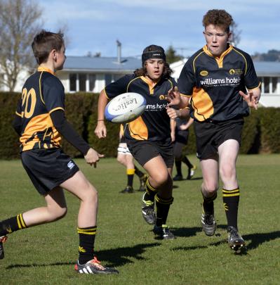 Warming up at the under-15 junior rugby tournament at Peter Johnstone Park in Mosgiel yesterday...