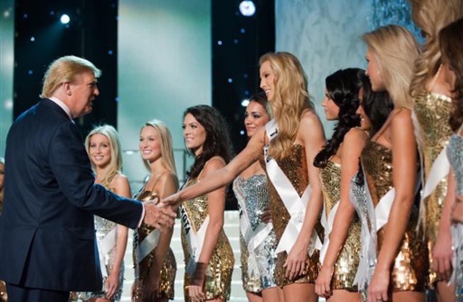 Donald Trump meets contestants.  (AP Photo/Miss Universe Organization, Greg Harbaugh)