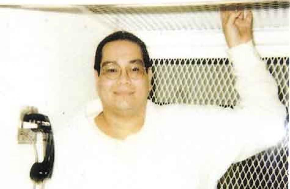 Charles Don Flores in an escape-proof visitation booth at Polunsky Unit, South Livingston, Texas.