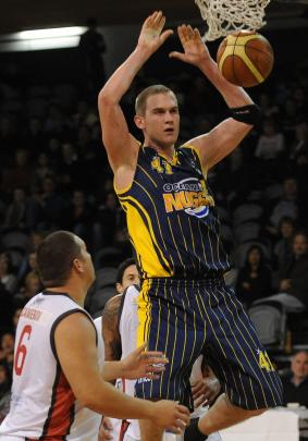 Allred in his Otago Nuggets playing days, going up for a shot against the Waikato Pistons in a...