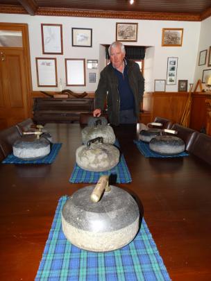 John Perriam with his collection of Scottish curling stones. Photos by Mark Price.