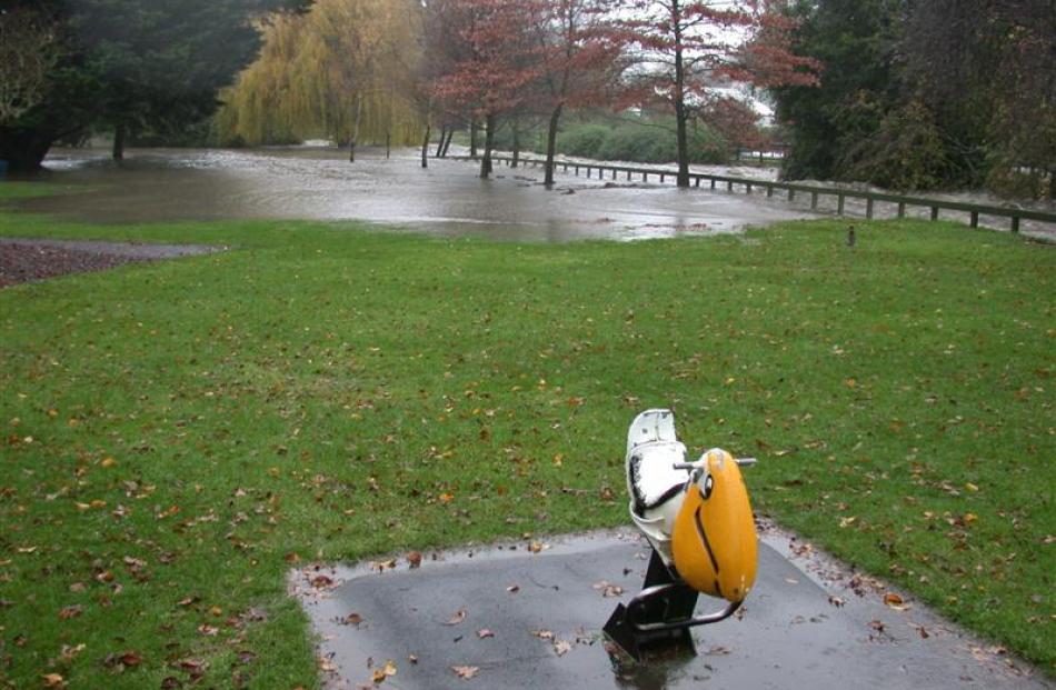 No play today - the Oamaru Creek breaks its banks and floods the playground area in the Oamaru...