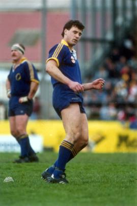 Otago fullback Greg Cooper successfully lands a penalty at Carisbrook in 1991 in front of prop...