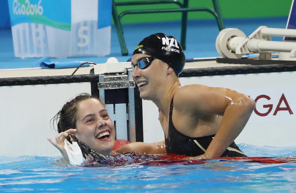 Aurelie Rivard (left) and Sophie Pascoe congratulate each other taking winning gold and silver in...