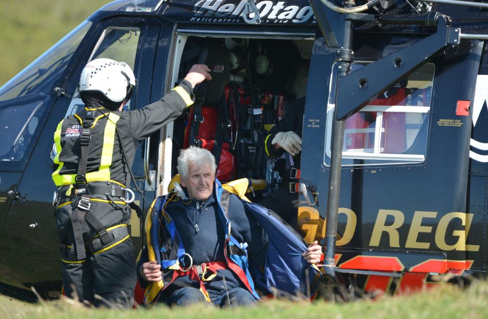 Port Chalmers fisherman Warren Lewis is winched to safety by rescue helicopter after his boat Renegade caught fire off Heyward Point, near Dunedin, yesterday.