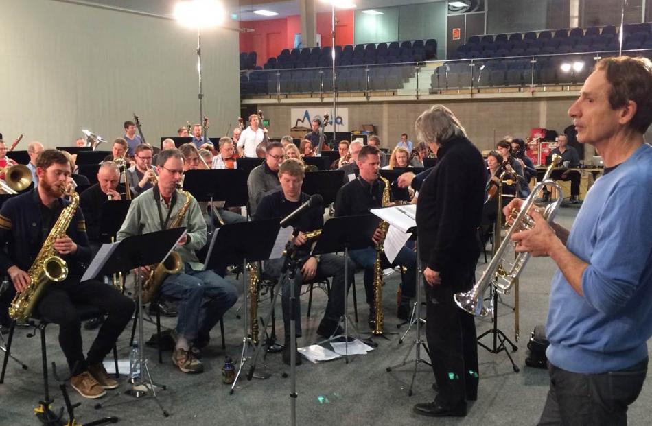 Allen Vizzutti (right) rehearses with Rodger Fox and his assembled musicians.