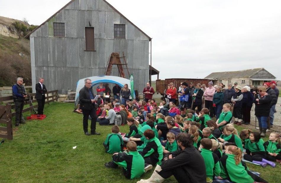 Part of the crowd is welcomed by Paul McGeown,  South Island manager for Heritage New Zealand.