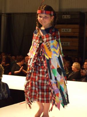 Lilly McQueen (7) wears Millers Flat School’s junior room entry, called Feathered and Tartaned...