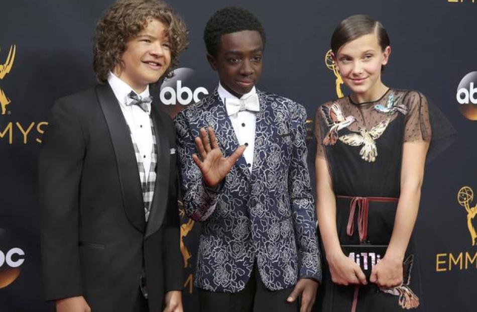 Actors Gaten Matarazzo (left), Caleb McLaughlin and Millie Bobby Brown from the Netflix series ...