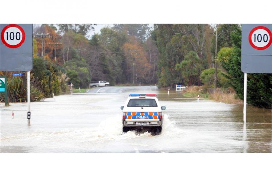 Macandrew Bay residents Ron Lee and Claire Gallop get their emergency water supply. Photo by...