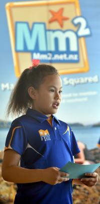 Arthur Street School pupil Moana Quensell (8) discusses data gathered by the school on the effects of dredging on sea creatures during the Sediment and Seashores Project report-back session at the University of Otago Rowing Club yesterday. Photos by Peter