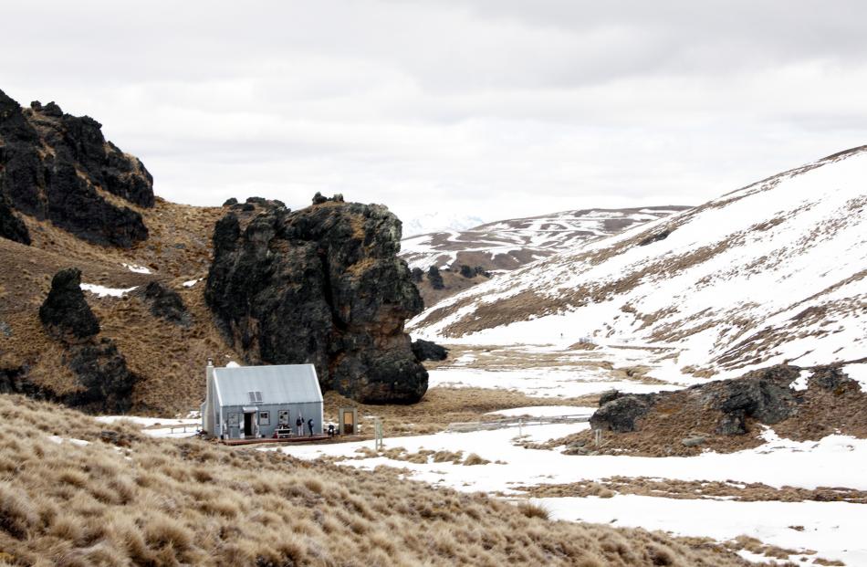 Meadow Hut nestles by a particularly expressive rock outcrop. PHOTO: LAUREN RIMMER
