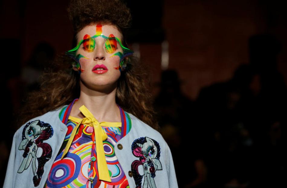 A model decked in a colourful outfit by Indian designer Manish Arora. Photo: Reuters