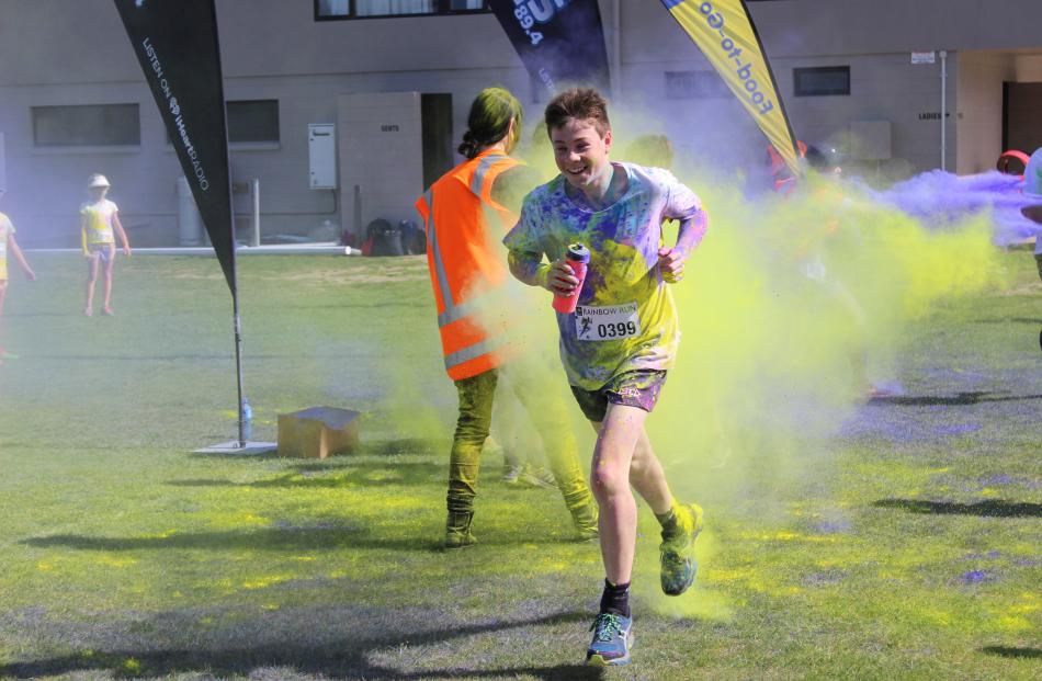 Ettrick boy Charlie Marsh (15) runs at such a speed he creates a yellow trail.  